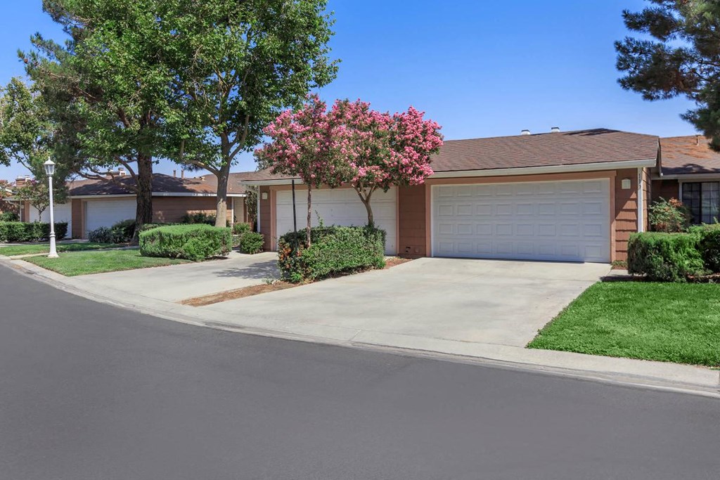 a house with a driveway and a garage door