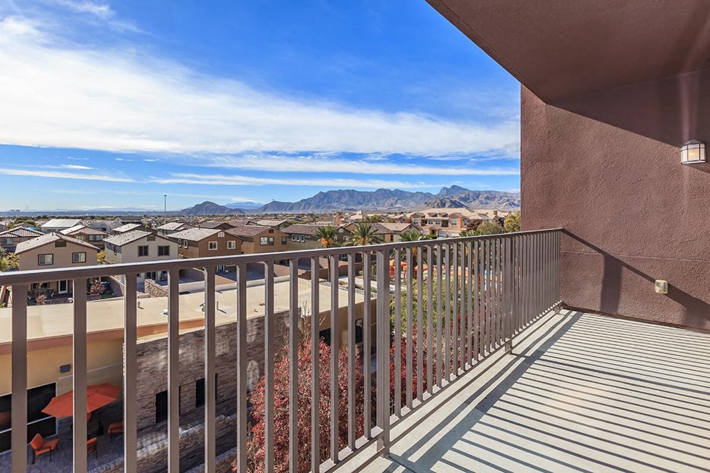 a balcony with a view of the city and mountains