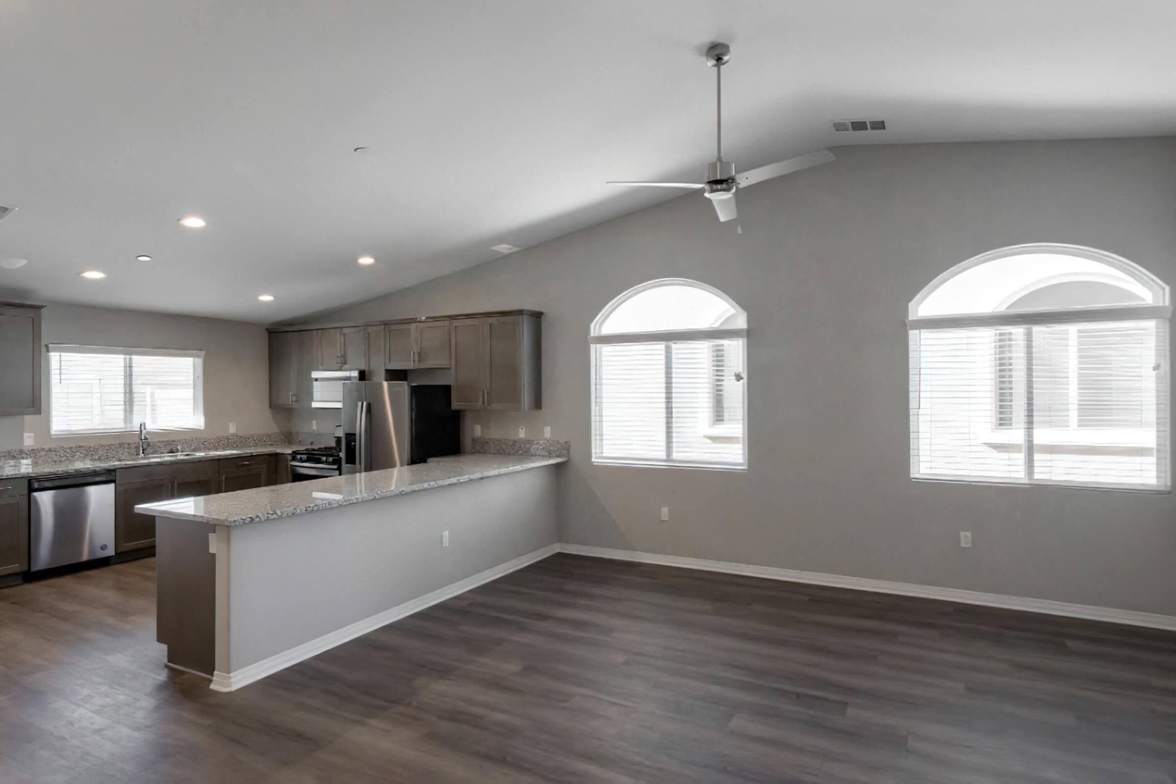a kitchen with an island and a large window