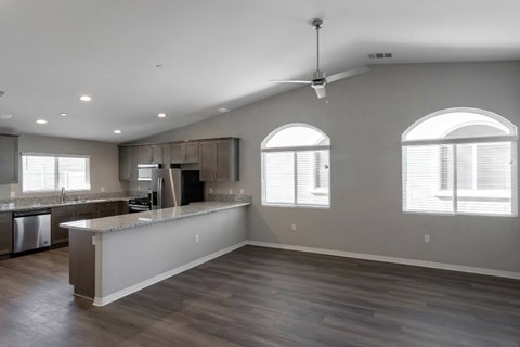 a kitchen with an island and a large window