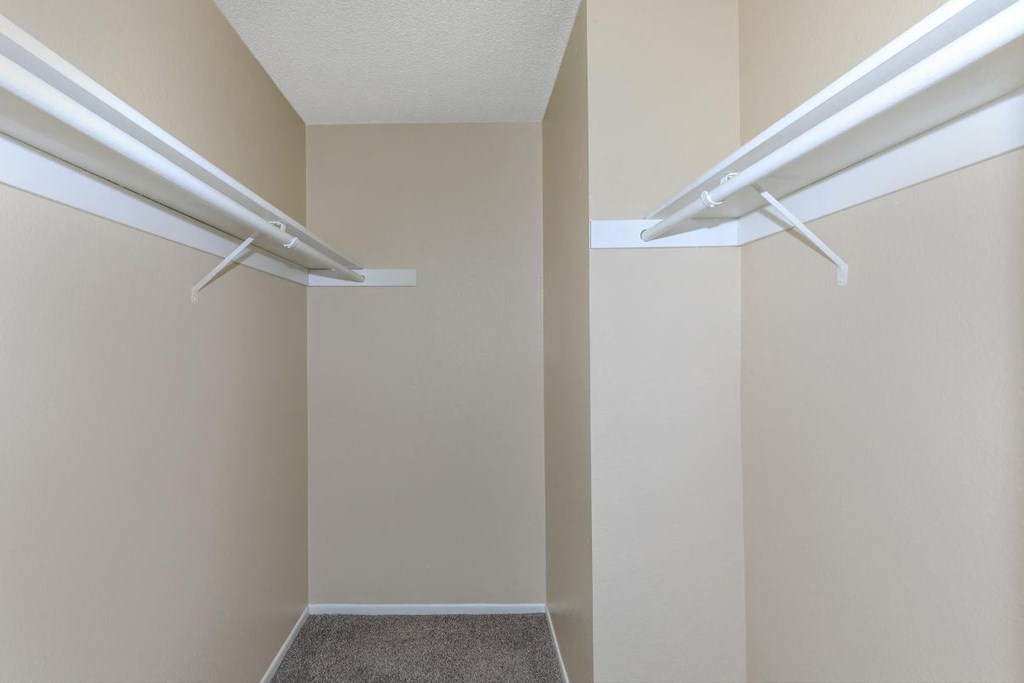 A hallway with two white rails on the wall.