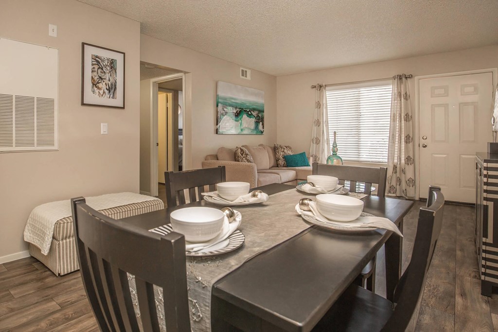 a dining room with a table and chairs