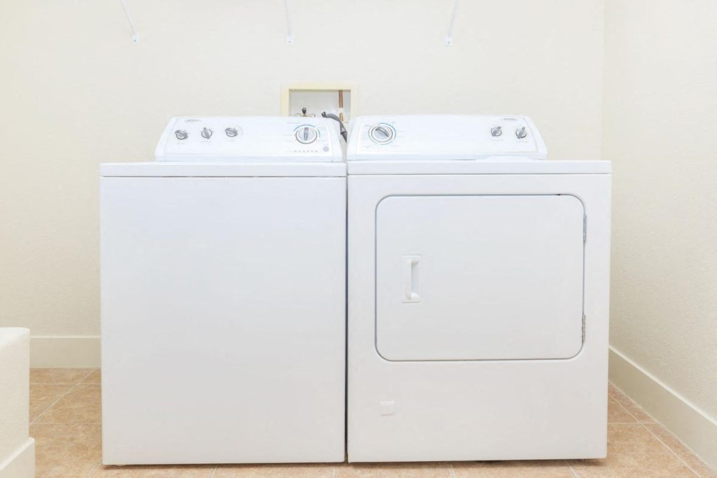 a white washer and dryer next to each other