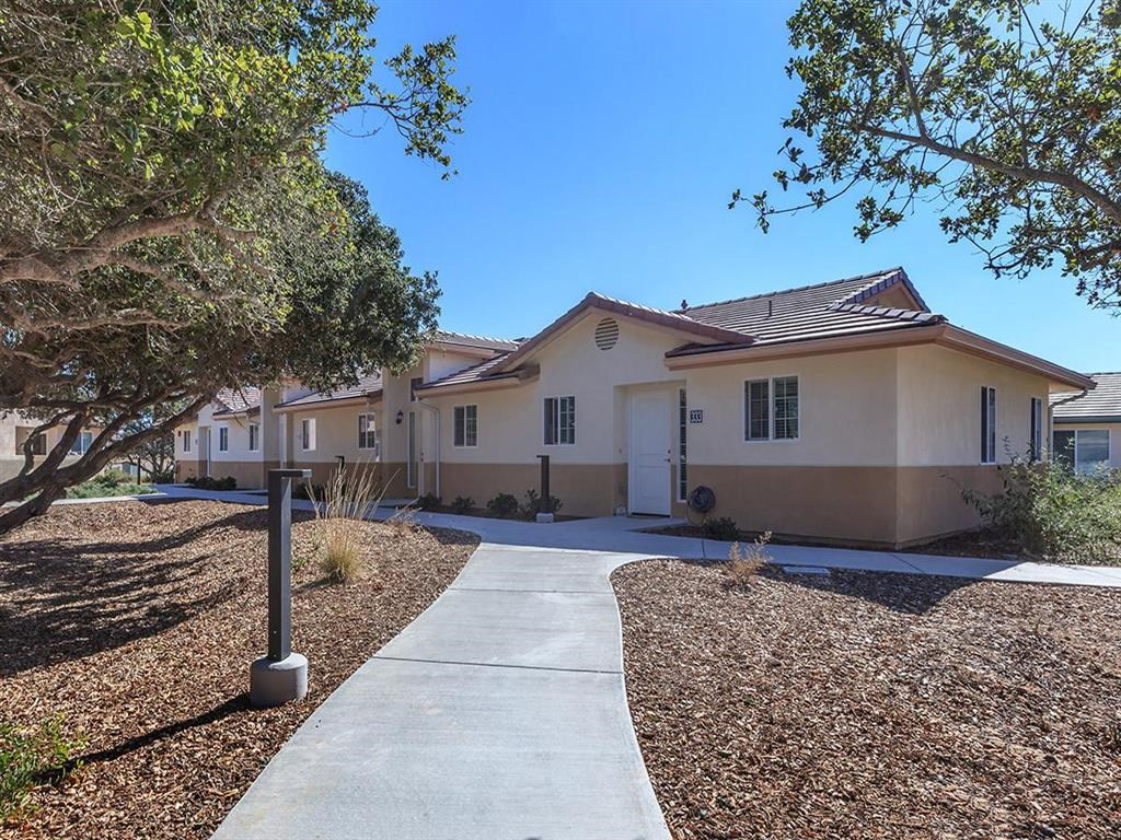 a sidewalk in front of a house