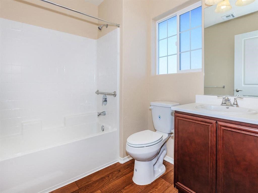 a bathroom with a shower toilet and a sink