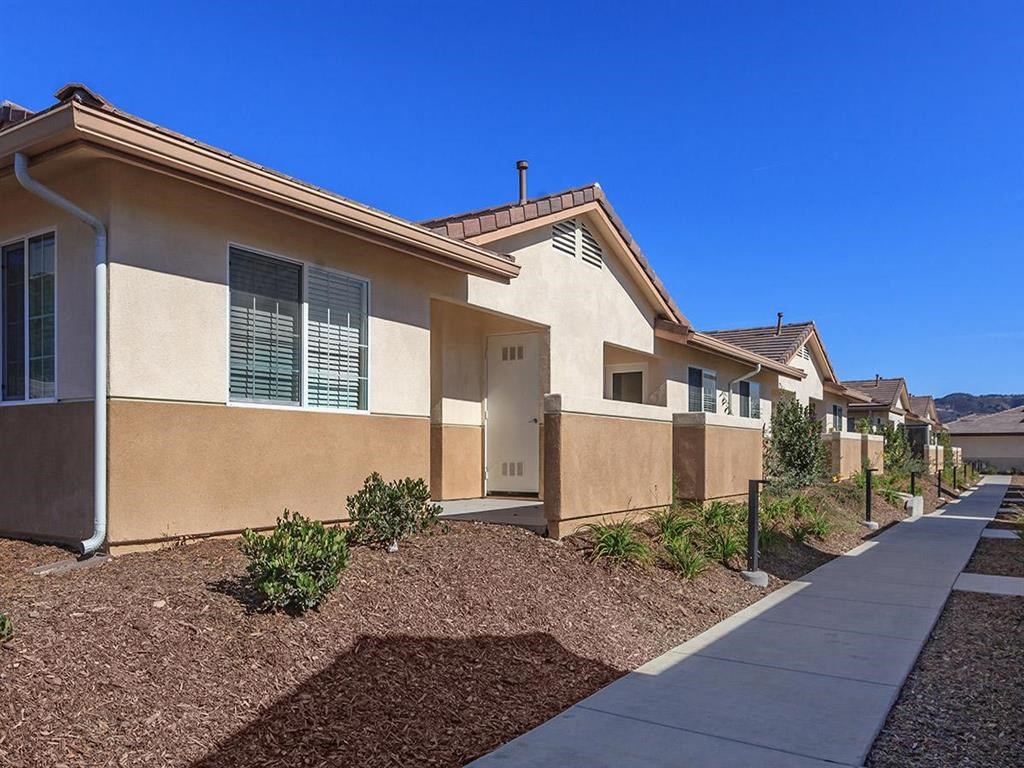 a house with a sidewalk in front of it