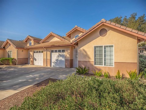 a house with a driveway and a garage door