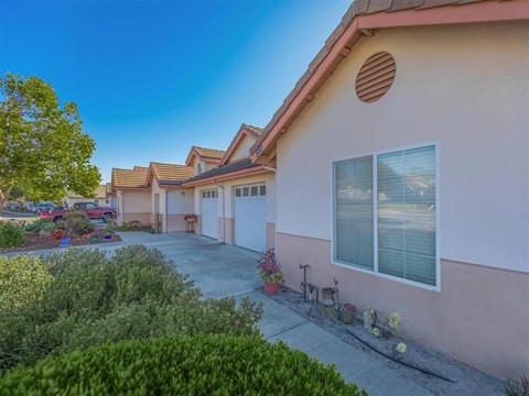 a house with a driveway and a parking lot