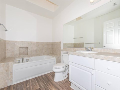 a bathroom with a sink toilet and a bath tub