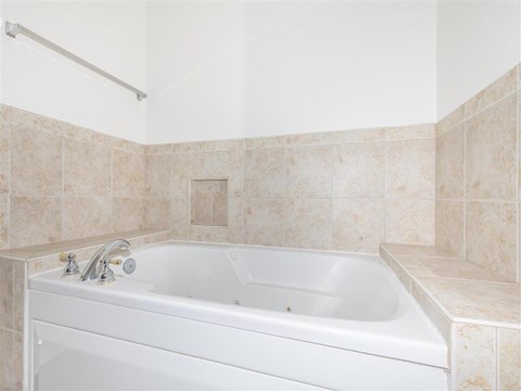 a bathroom with a bath tub and a sink