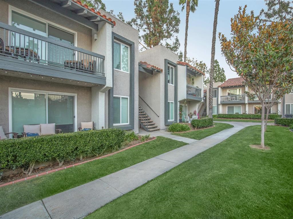 our apartments have a spacious courtyard with grass and trees