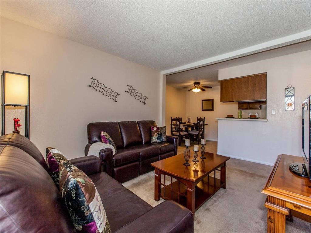 a living room with couches and a table