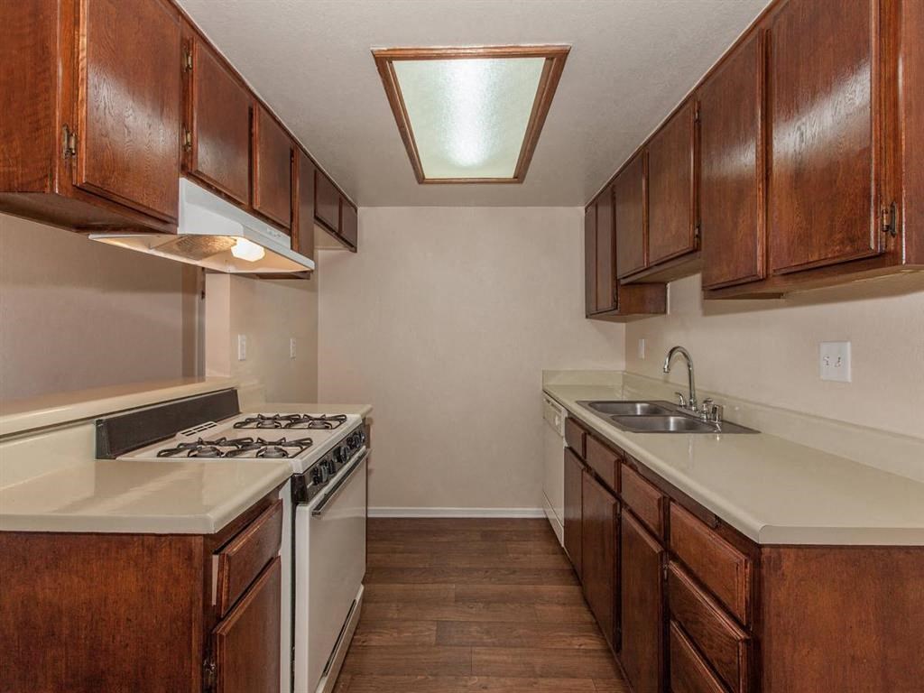 a kitchen with a stove and a sink