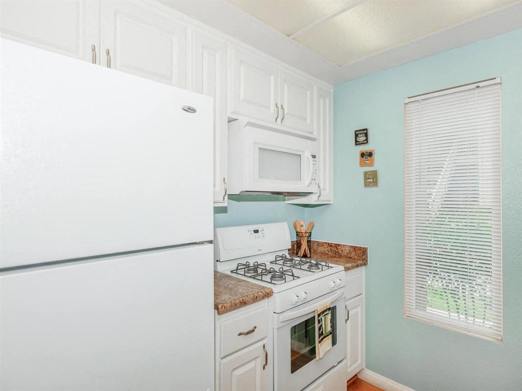 a kitchen with a stove and a refrigerator