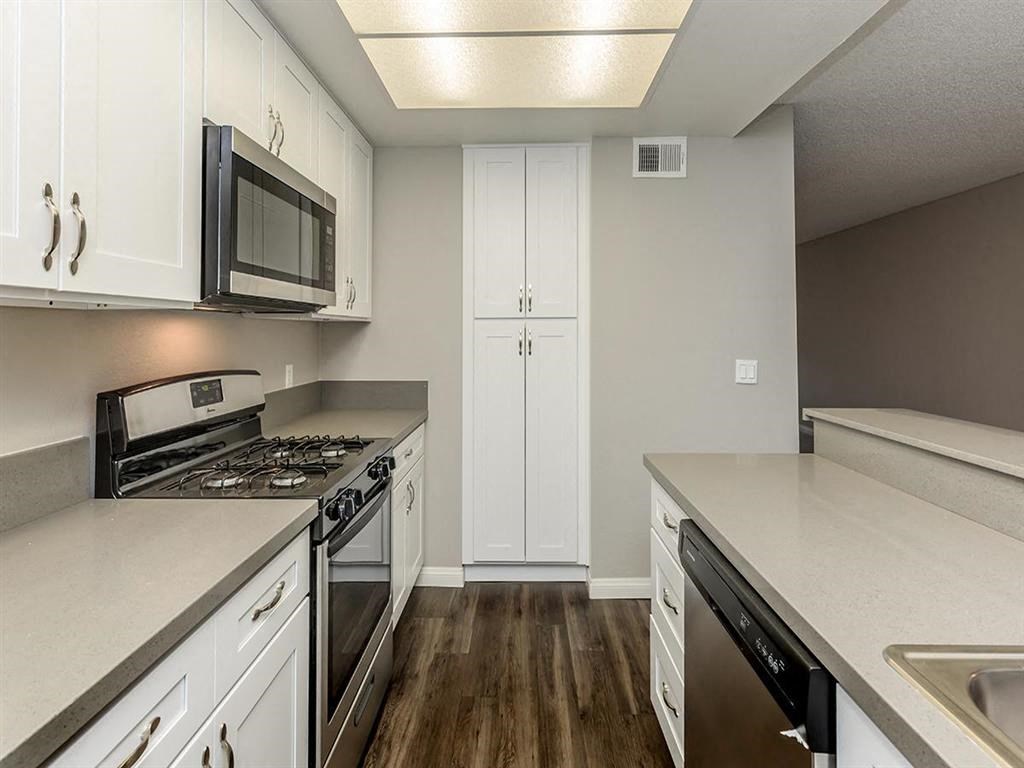 a kitchen with a stove and a microwave