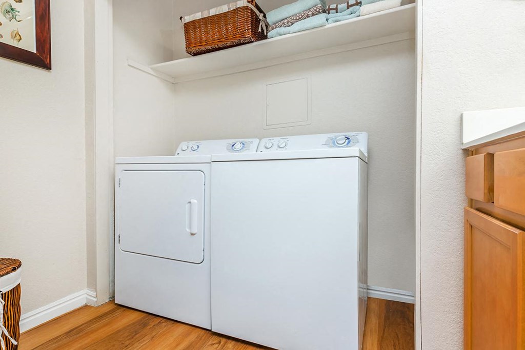 a laundry room with a washer and dryer in it