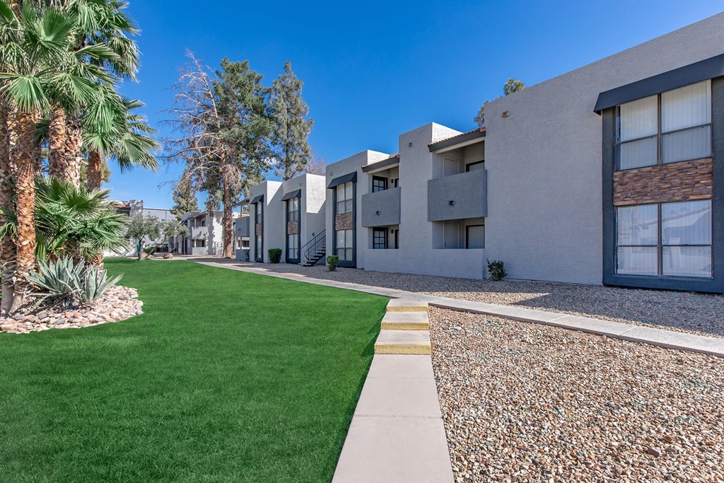 modern apartment buildings with grass and trees at the mix apartments