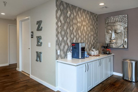 a kitchen with a counter and a coffee machine