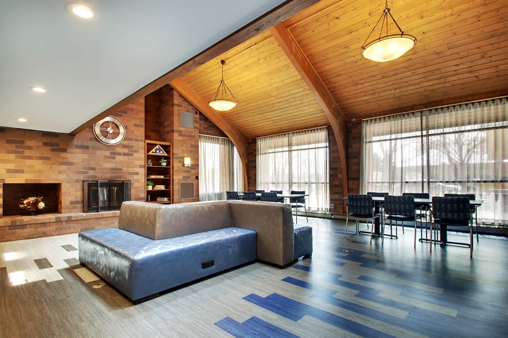 a living room with a couch and a table and chairs