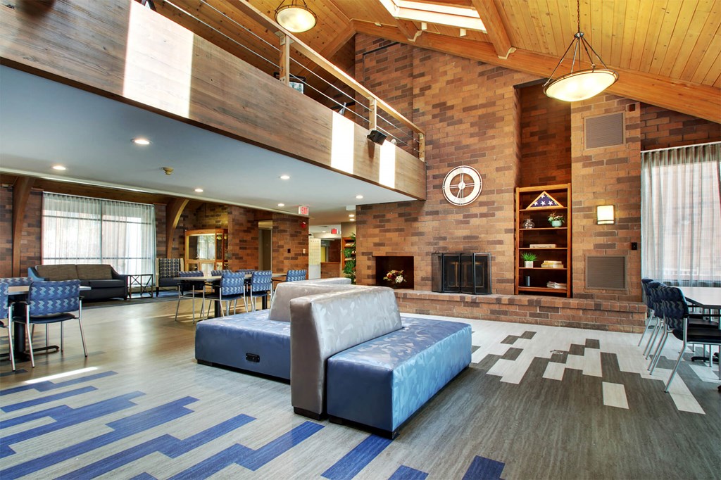 a living room with a couch and a fireplace