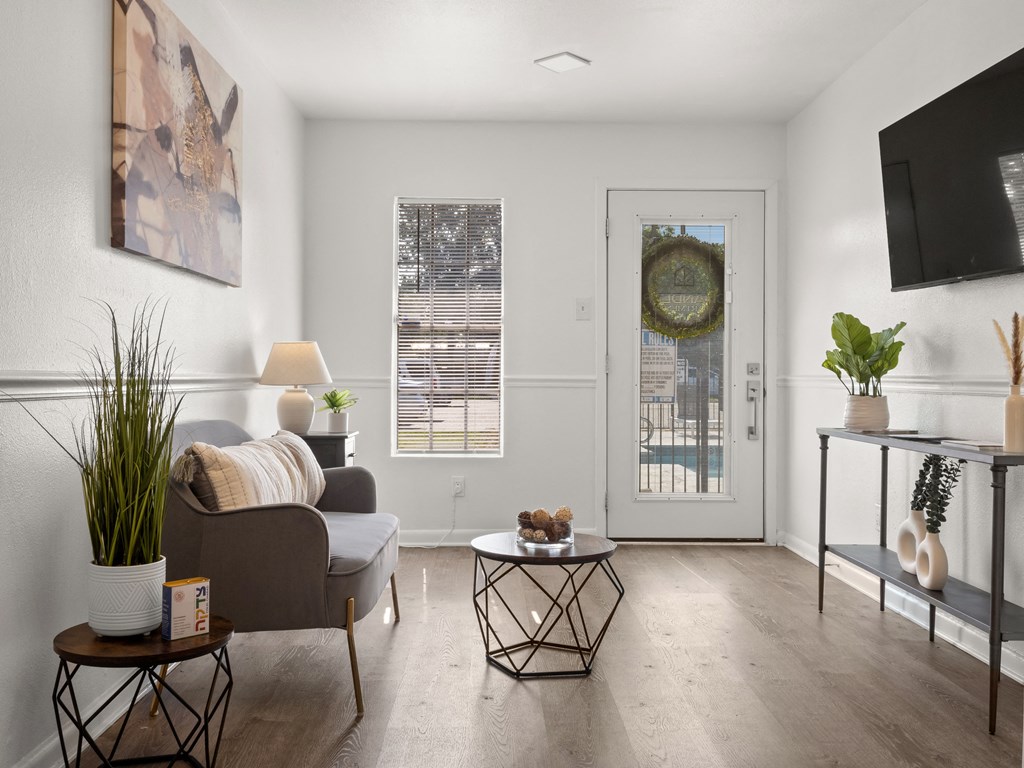 a living room with a couch and a door to a patio