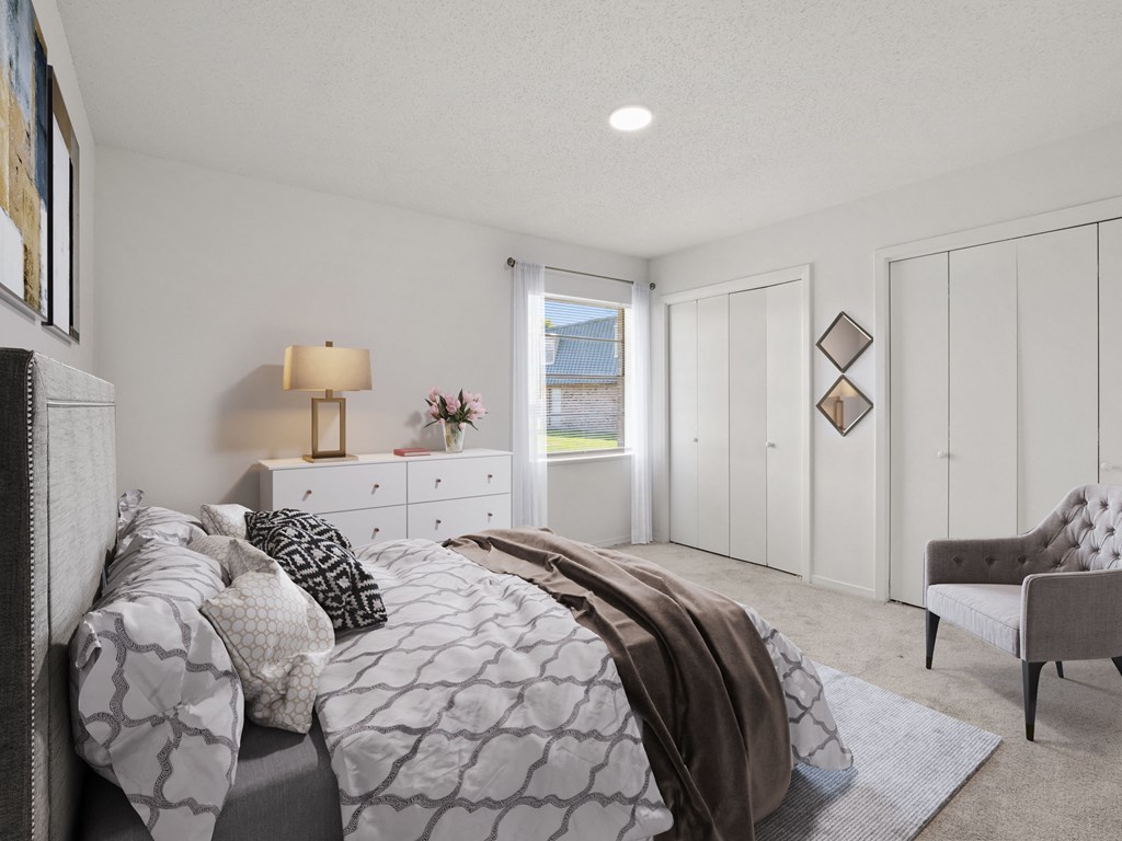 a bedroom with a bed and a dresser