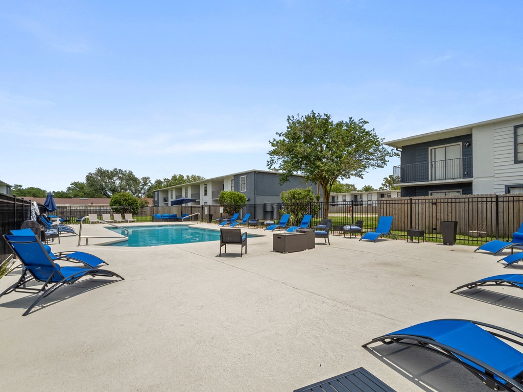 our apartments have a large pool and lounge chairs