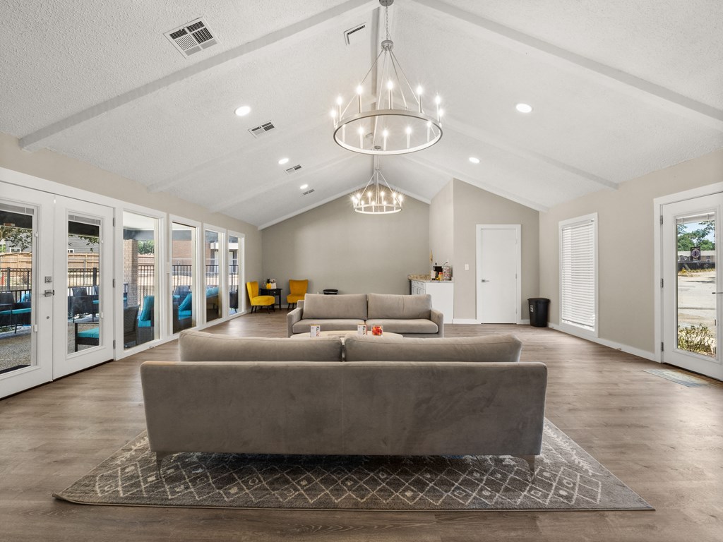 the preserve at gateway living room with couches and a chandelier