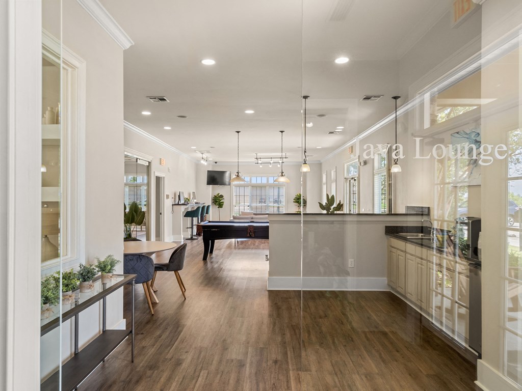 a dining room with a bar and a billiards table