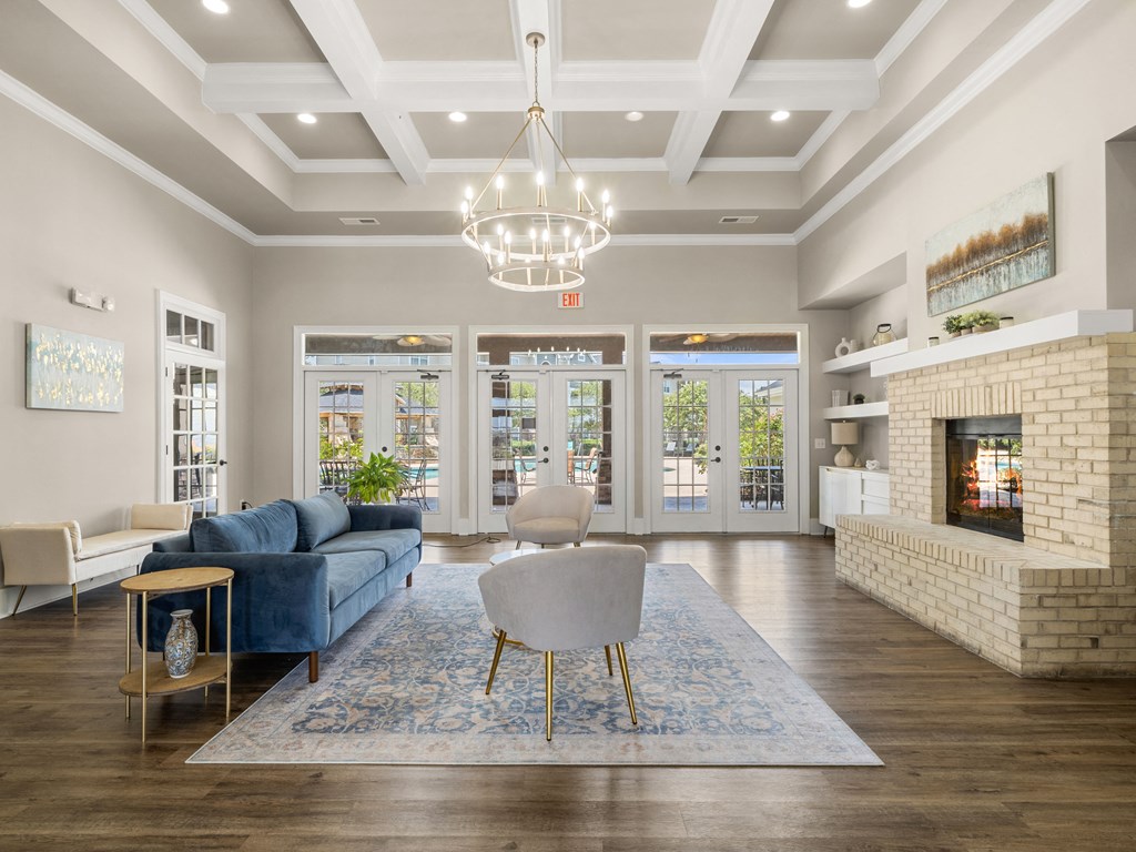 a living room with a blue couch and a fireplace