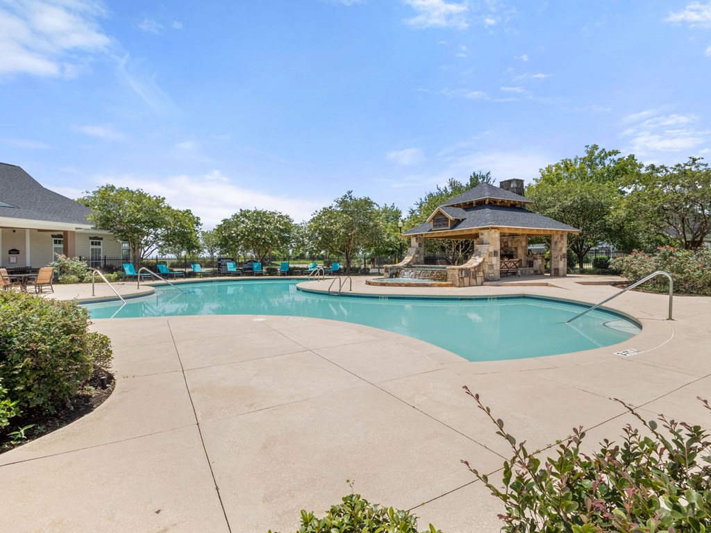 the preserve at ballantyne commons pool and spa with trees and a pool house