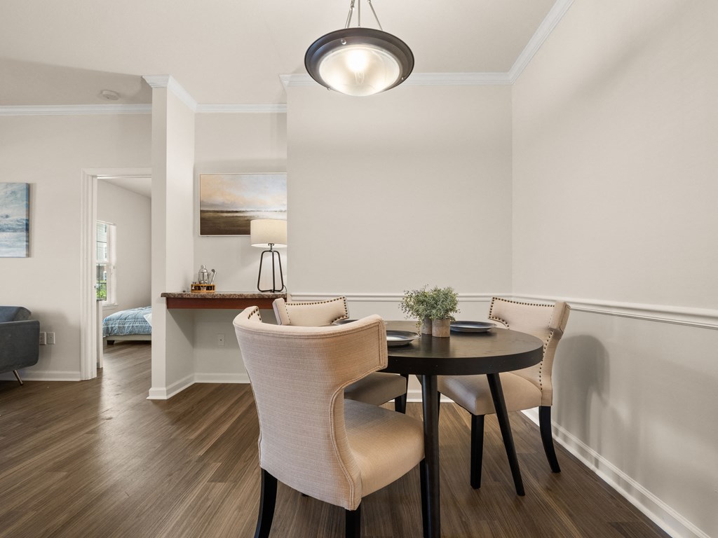 a dining room with a table and chairs