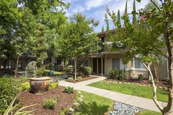 A walkway along one of the apartment buildings at Abby Creek Apartments, Carmichael, CA 95608 