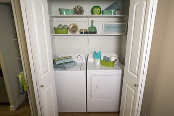 Model home laundry room and shelves at Abby Creek Apartments, California, 95608