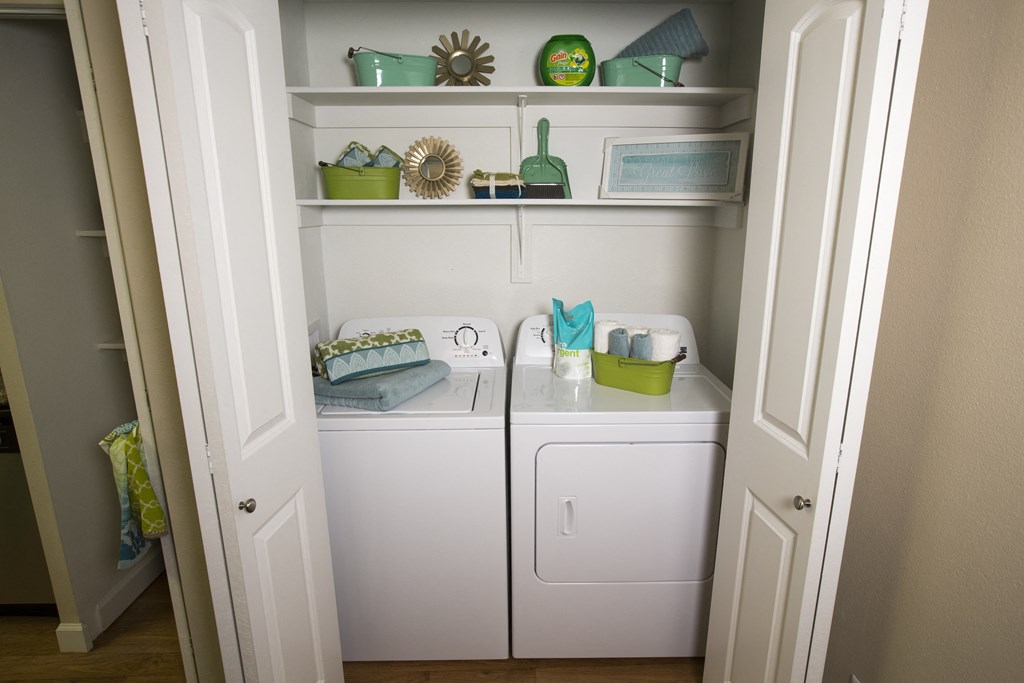 Model home laundry room and shelves