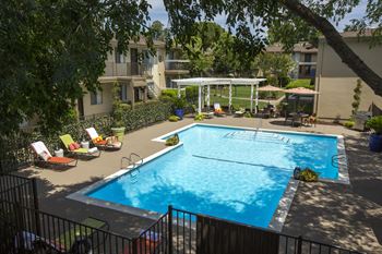 swimming pool view from an upstairs patio at Abby Creek Apartments, Carmichael, CA 