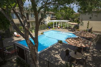 an aerial view of the pool and patio at Abby Creek Apartments, Carmichael California 