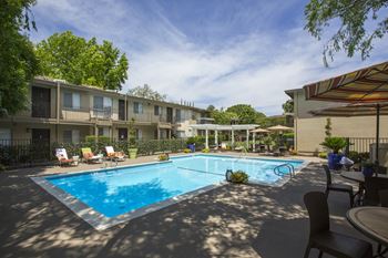 Swimming pool and pool furniture at Abby Creek Apartments, Carmichael, 95608 