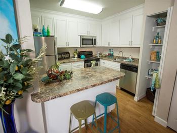 Model home kitchen and bar at Abby Creek Apartments, Carmichael 