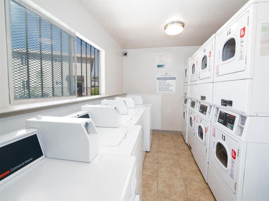 Large resident laundry facility filled with washers and dryers