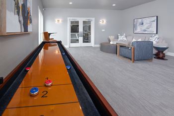 Salty board in resident lounge with seating at Rivercrest Apartments, California, 95826