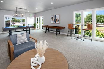 Resident lounge with a billiard table and seating area at Rivercrest Apartments, Sacramento, CA 95826 