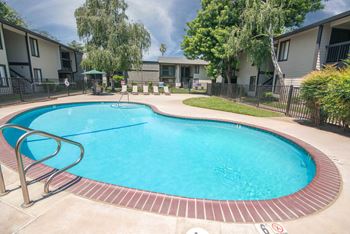 Swimming pool and pool furniture at Rivercrest Apartments, Sacramento, CA 