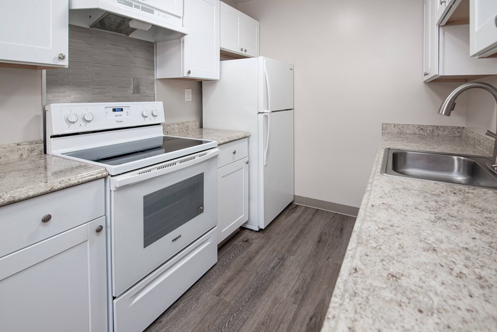Model kitchen with appliances and laminated counter tops