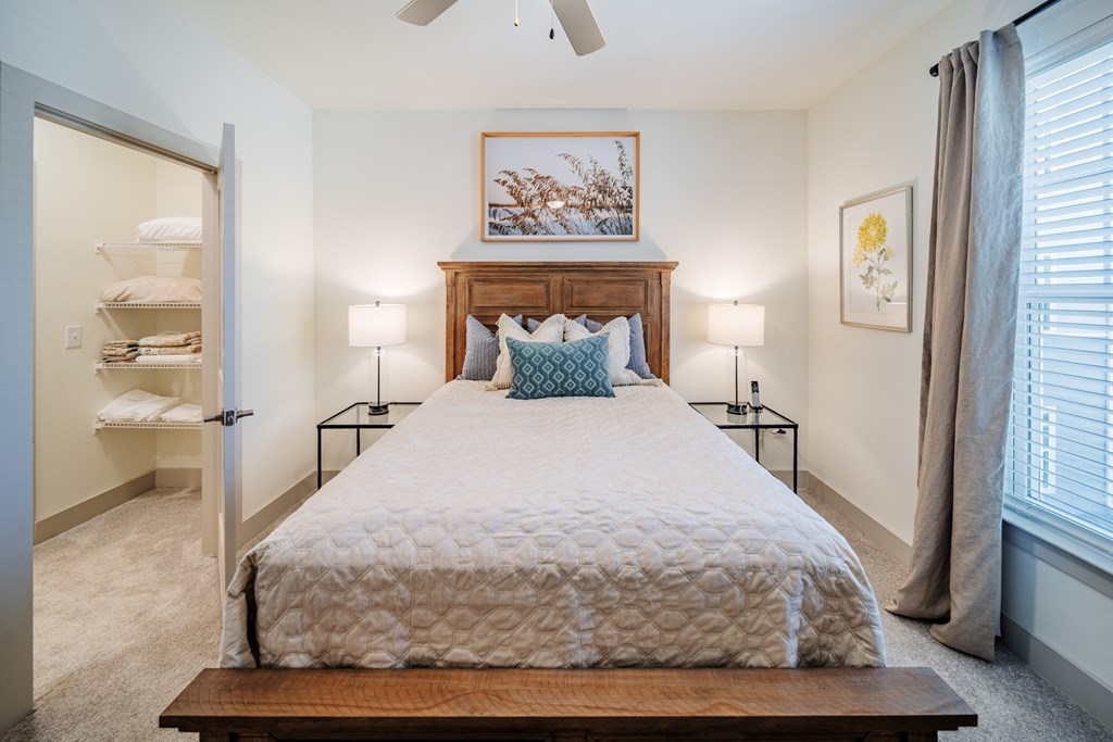 a bedroom with a large bed and a closet