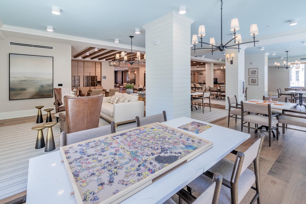 a dining room with a table and chairs and a living room
