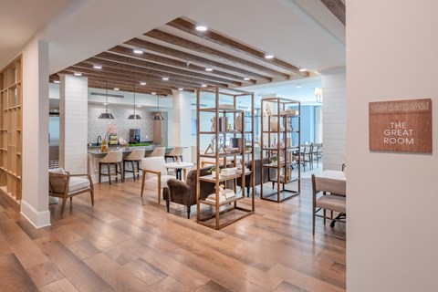 a dining room with wooden floors and tables and chairs
