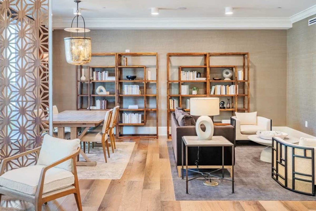 a living room filled with furniture and a table