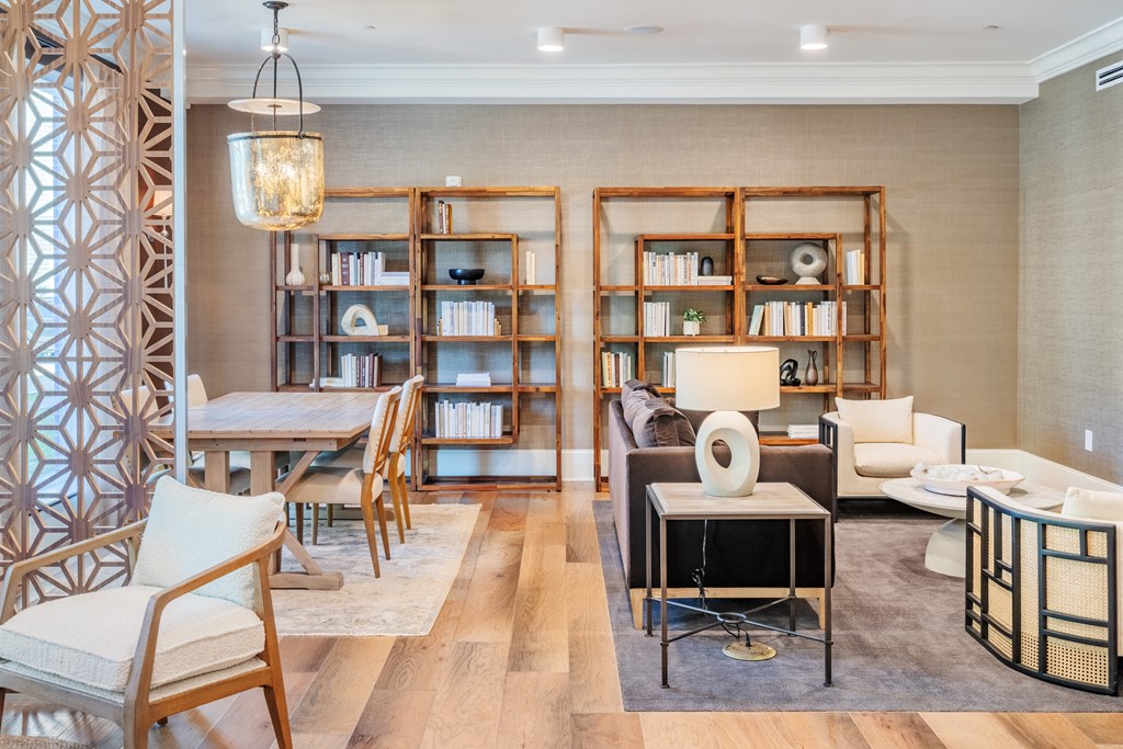 a living room filled with furniture and a table