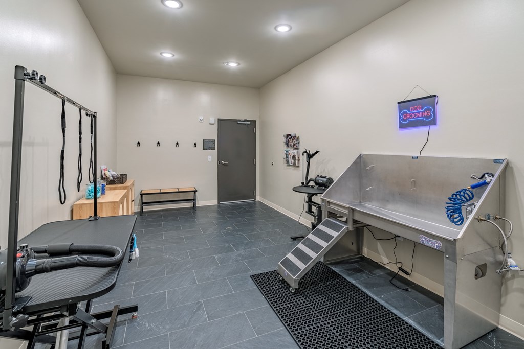 a gym with a treadmill and other equipment in a therapy room
